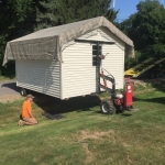 Kenosha 12x14 Gable being delivered through ditch